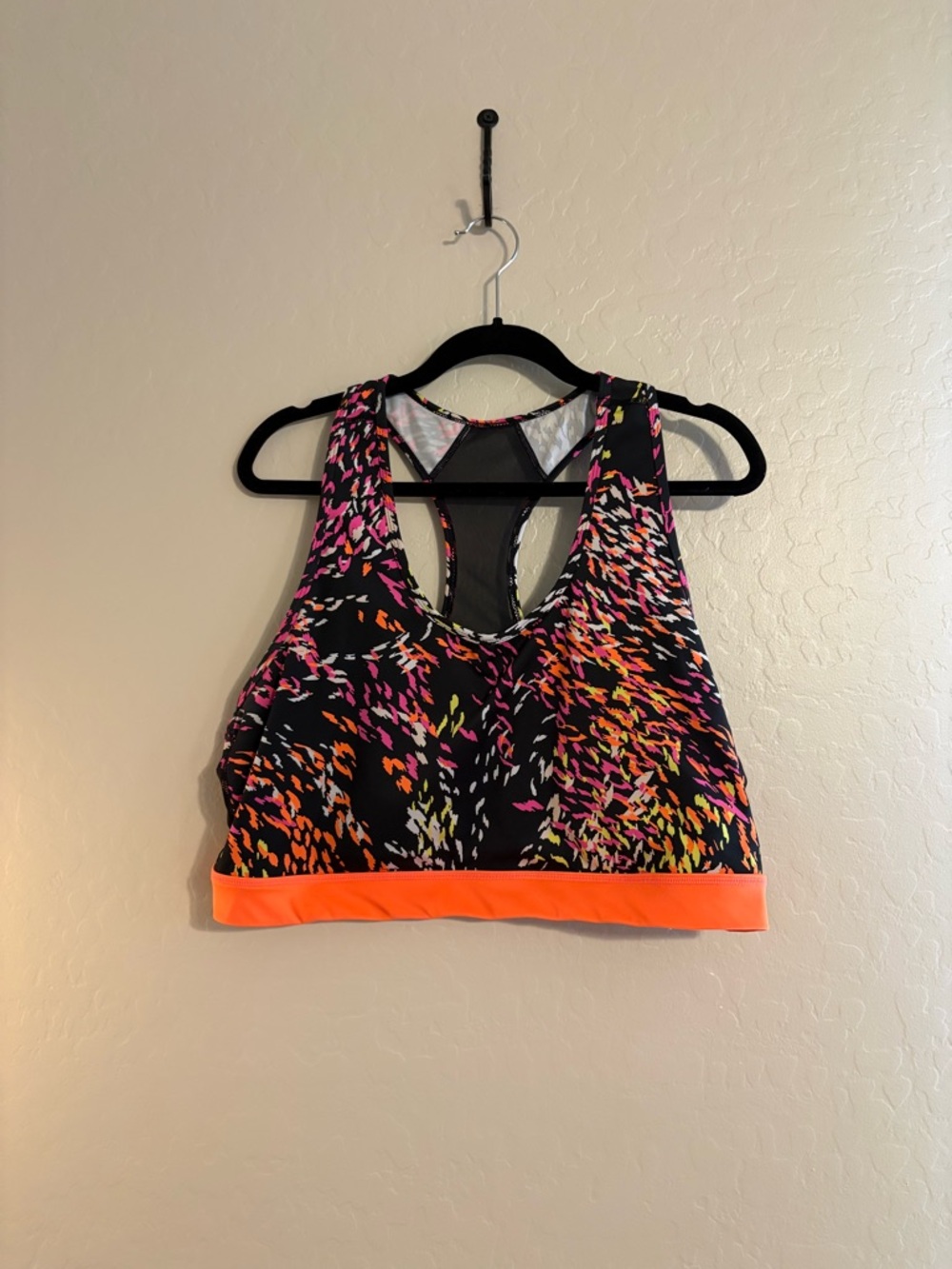 LuLaRoe Black Sports Bra with Neon Orange Band and Pink/Yellow Print